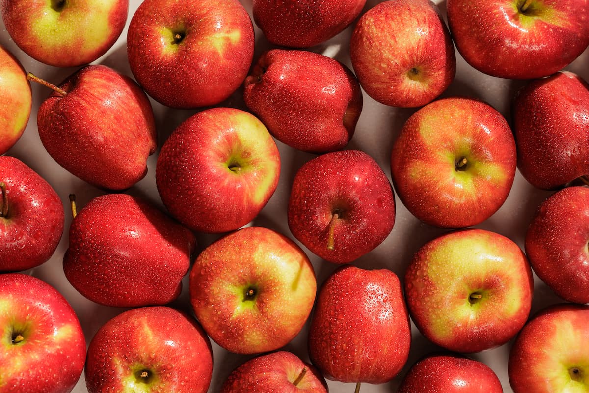 Fresh red apples with water droplets used in Rise and Puff recipes.