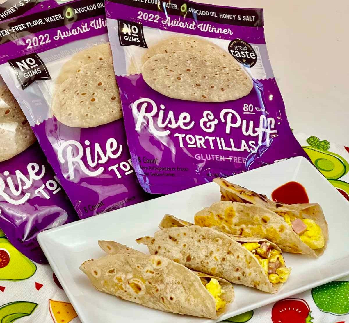 Rise and Puff gluten-free tortillas with breakfast tacos served on a white plate.