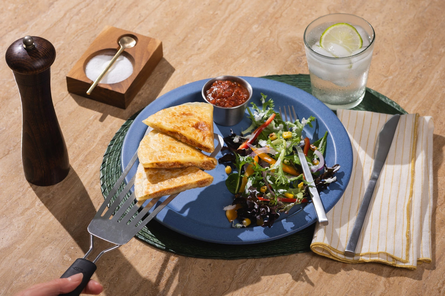 Crispy Rise & Puff quesadilla served with salsa and a fresh salad on a blue plate for a balanced meal.