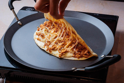 Chipotle chicken quesadilla filled with seasoned chicken, melted cheese, and smoky chipotle flavors, ready for quick heating.