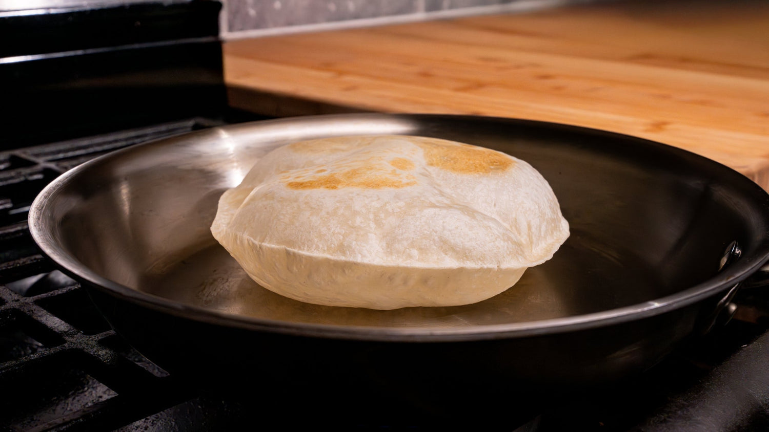 Rise & Puff’s tortilla gently puffing up in the skillet.