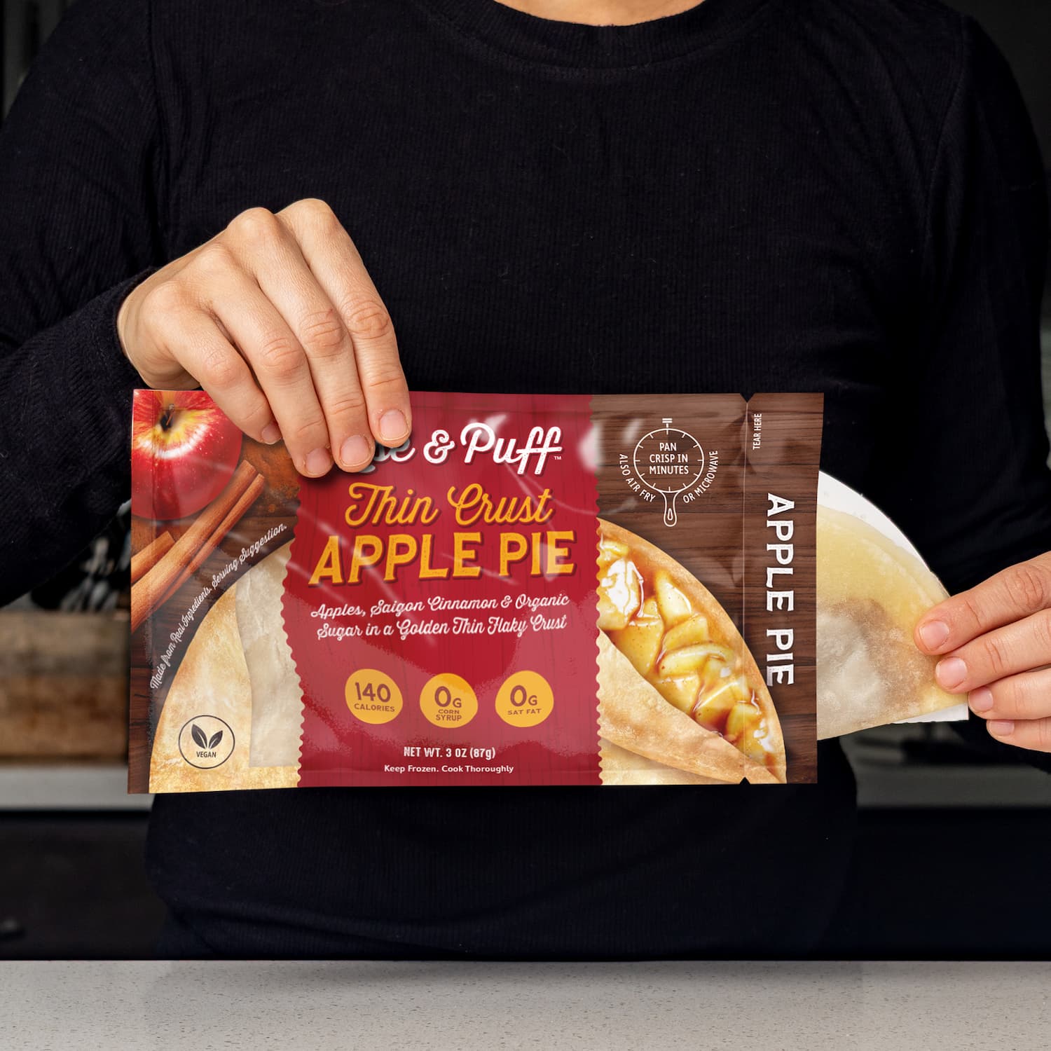 Rise & Puff Guiltless Apple Pie dessert being pulled out of packaging