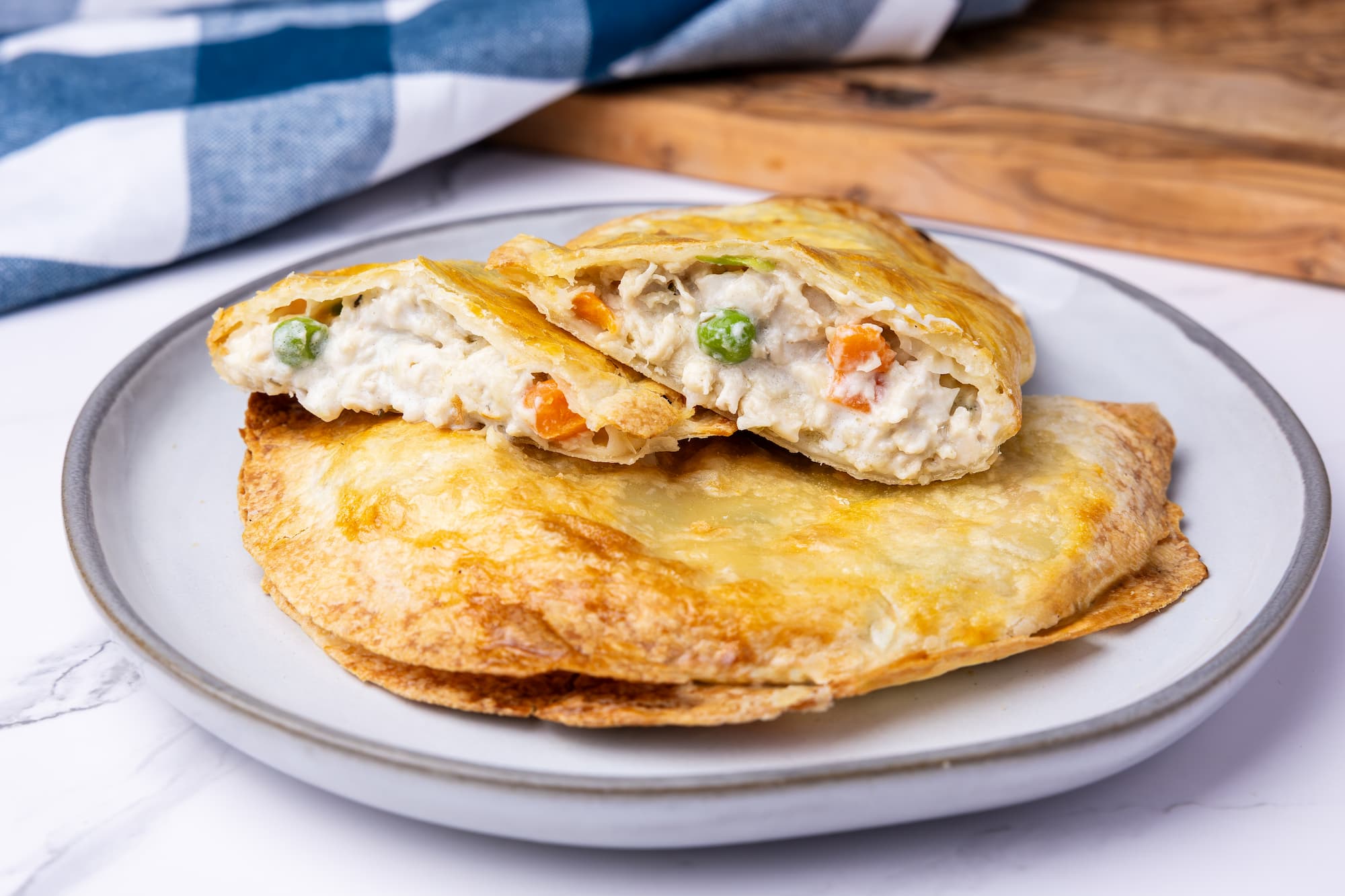 Hearty & Healthier Rise & Puff Chicken Pot Pie on a white plate ready in minutes