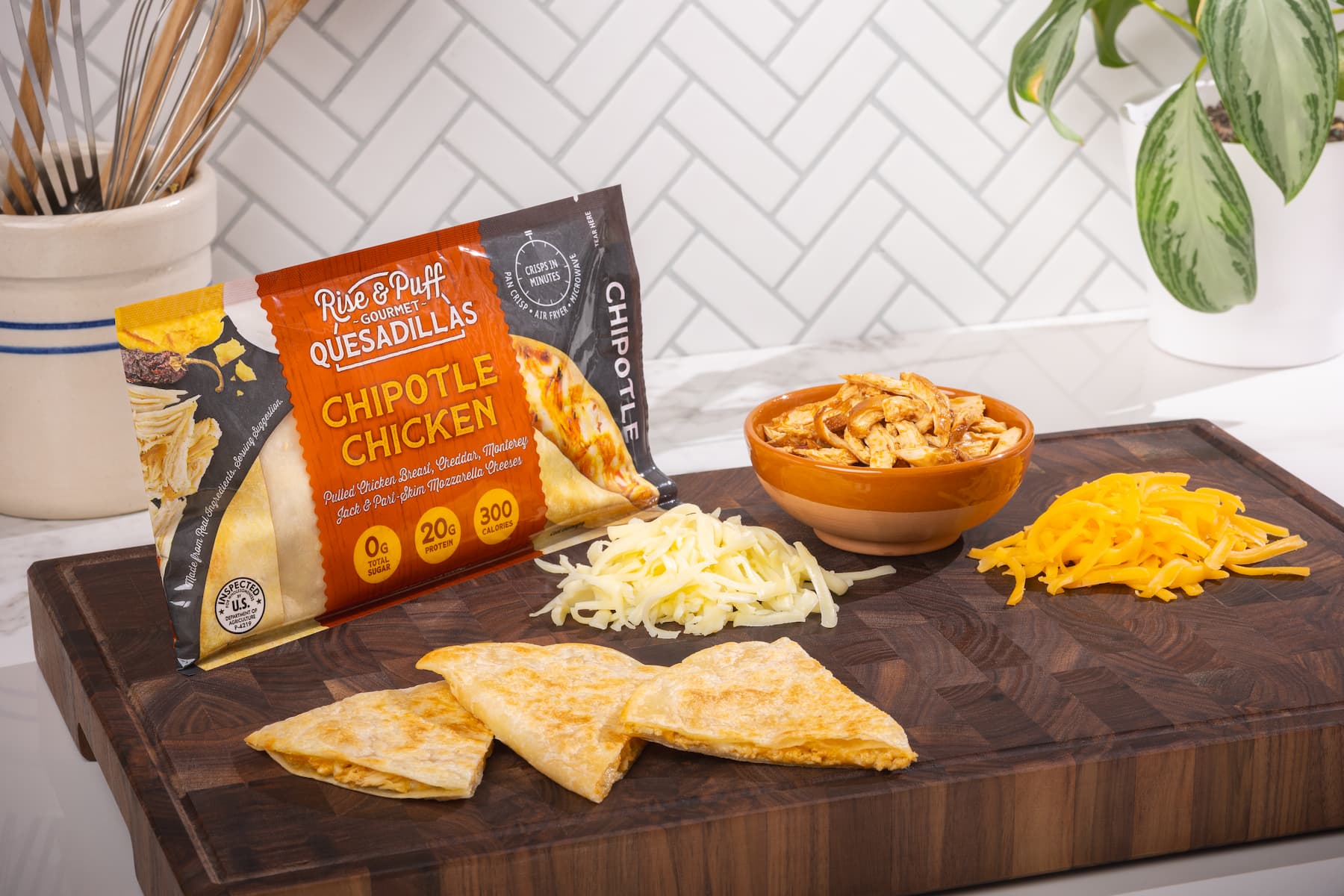 Chipotle Chicken Rise & Puff Quesadilla on a cutting board
