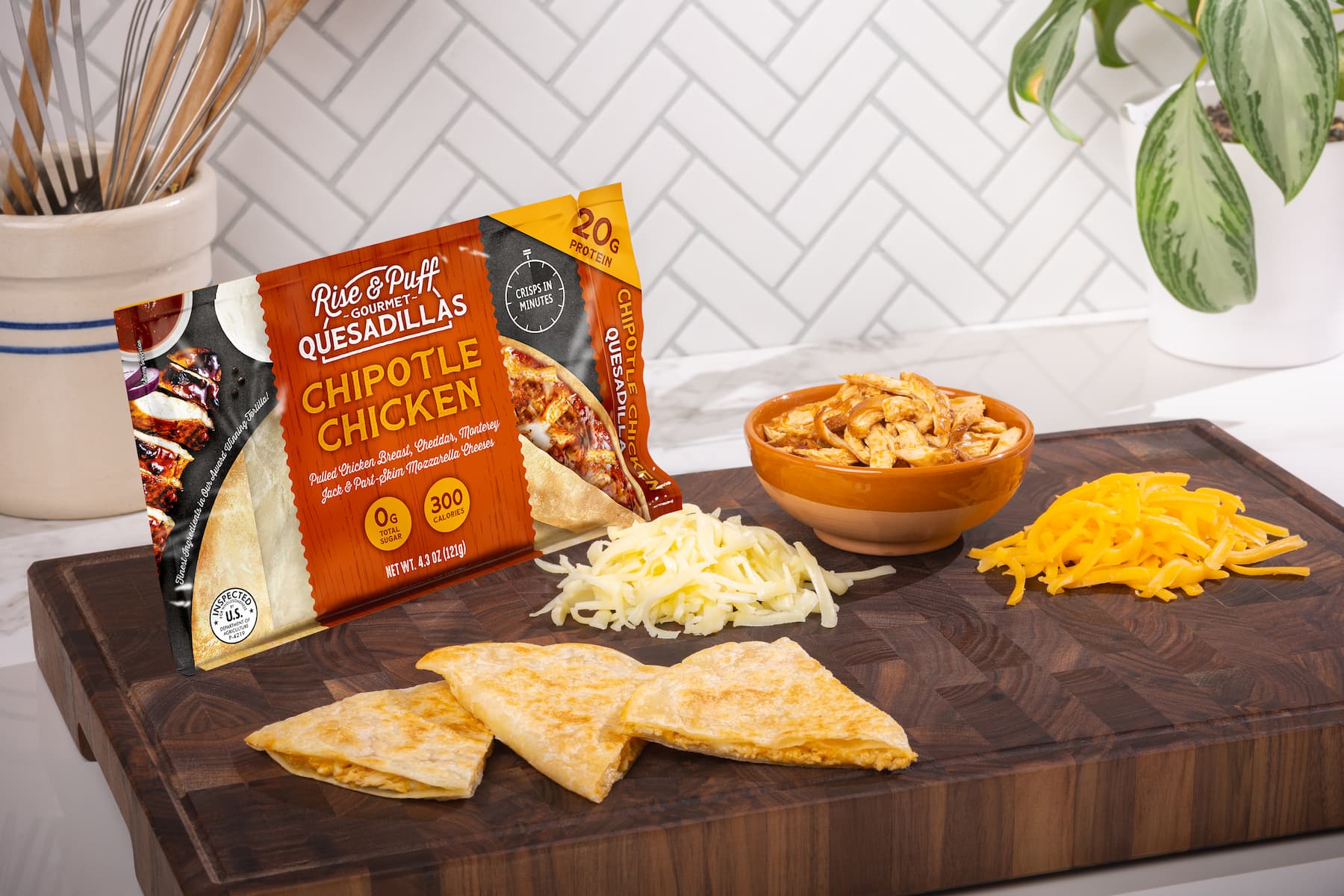 Chipotle Chicken Rise & Puff Quesadilla on a cutting board