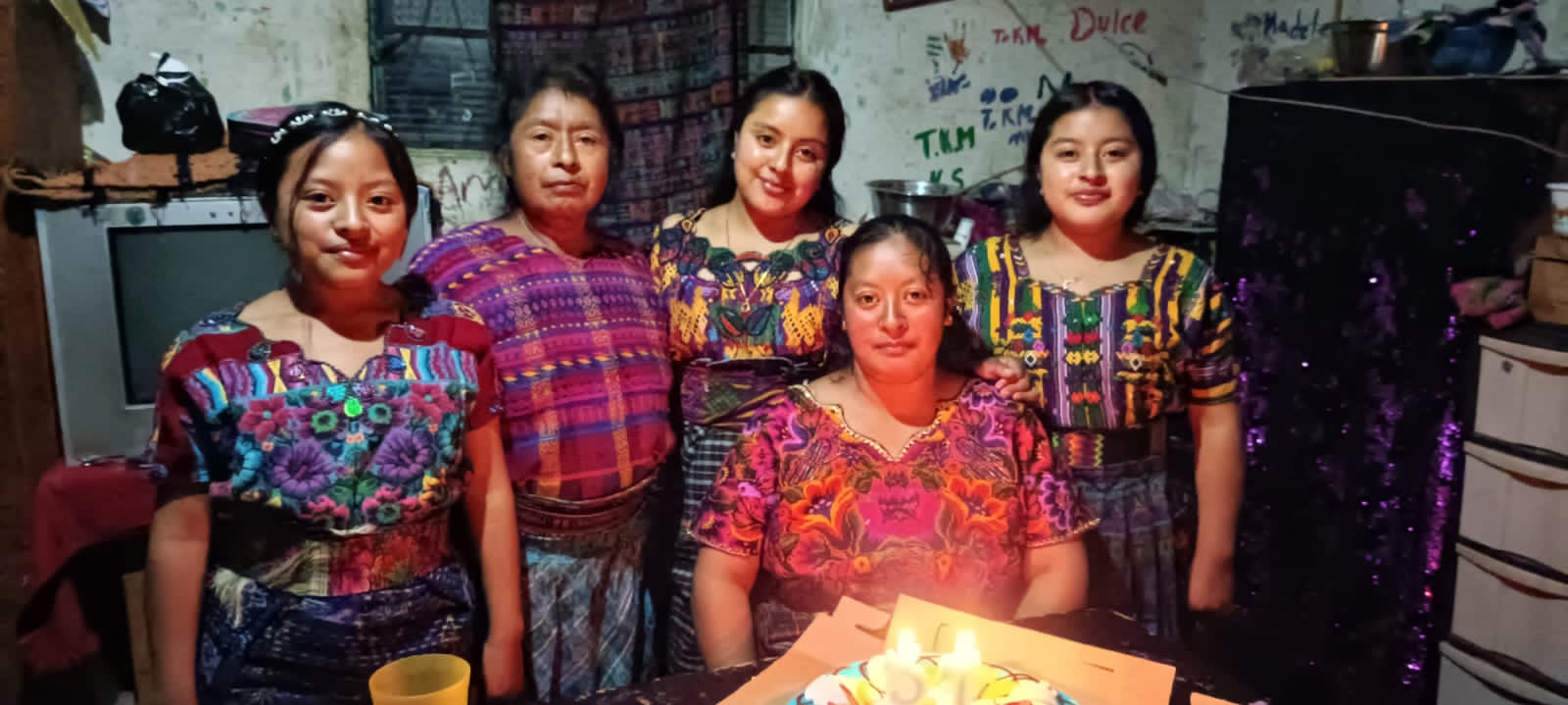 Sponsored student (with her family) that Rise and Puff helped get an education through the Cooperative for Education.