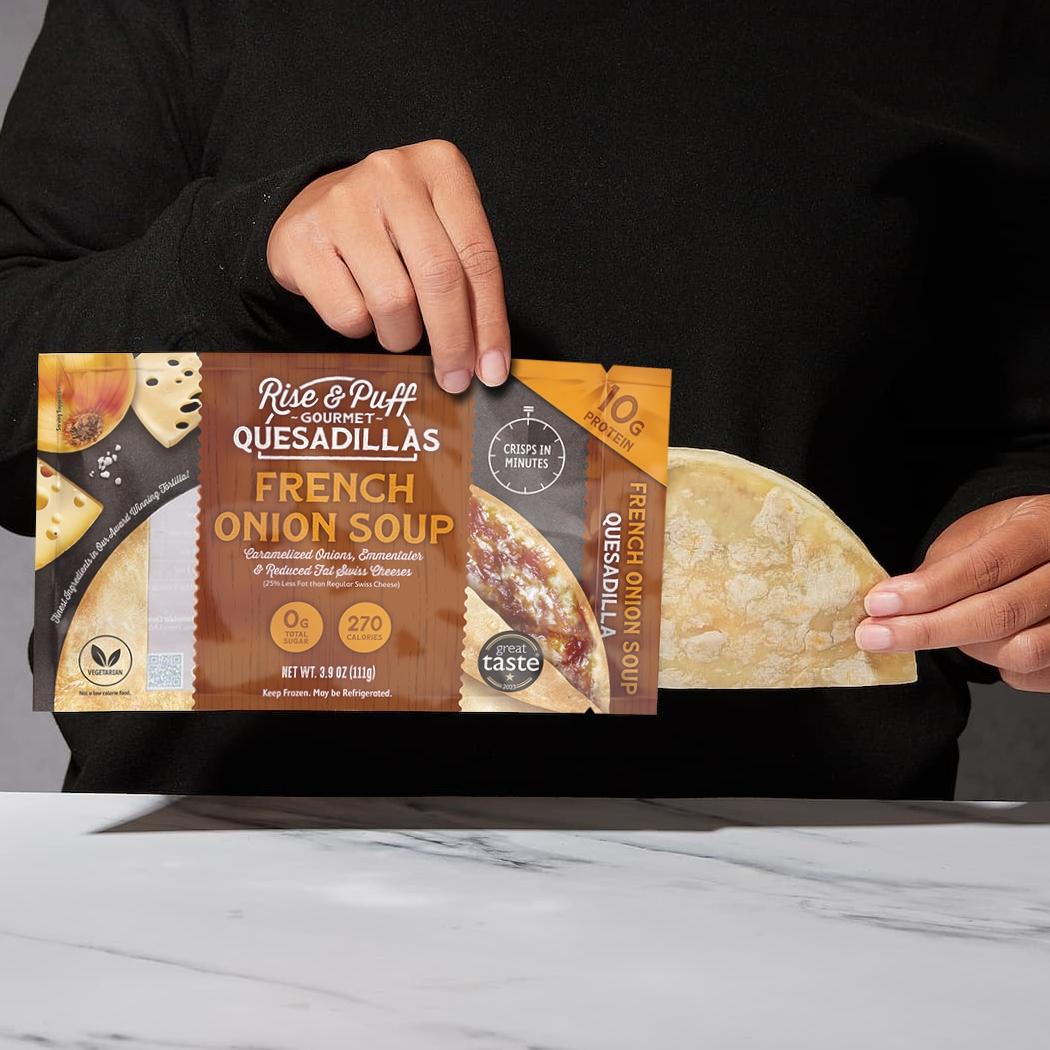 Rise & Puff French Onion Soup Quesadilla being pulled out of packaging