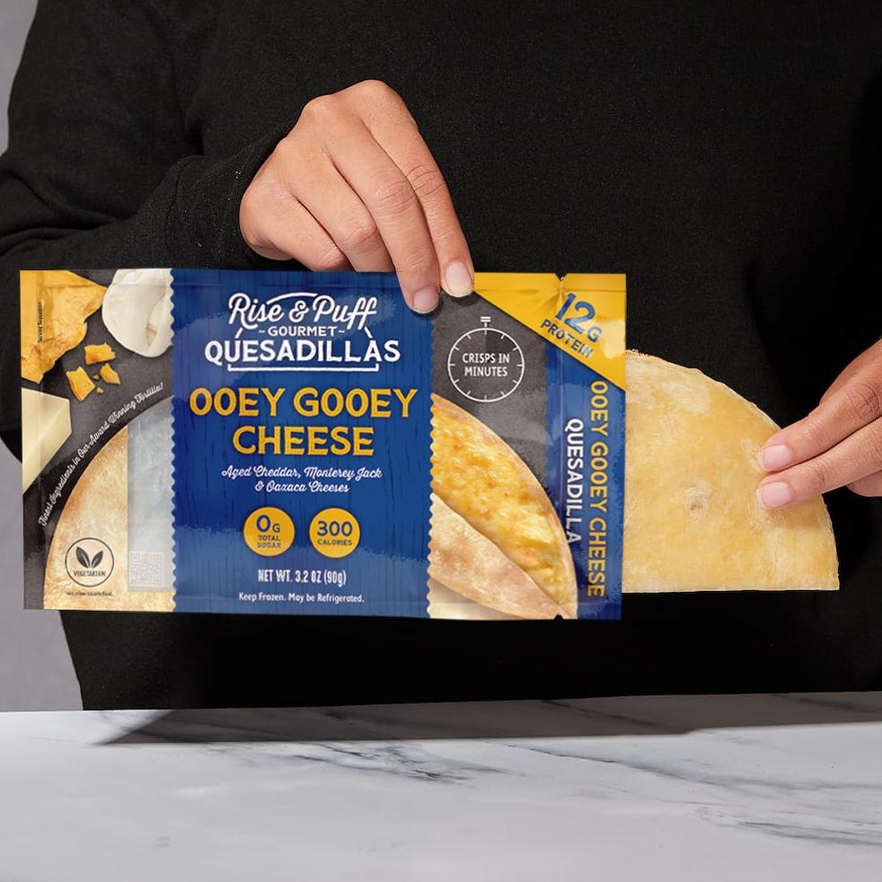 Ooey Gooey Cheese Quesadilla being pulled out of packaging