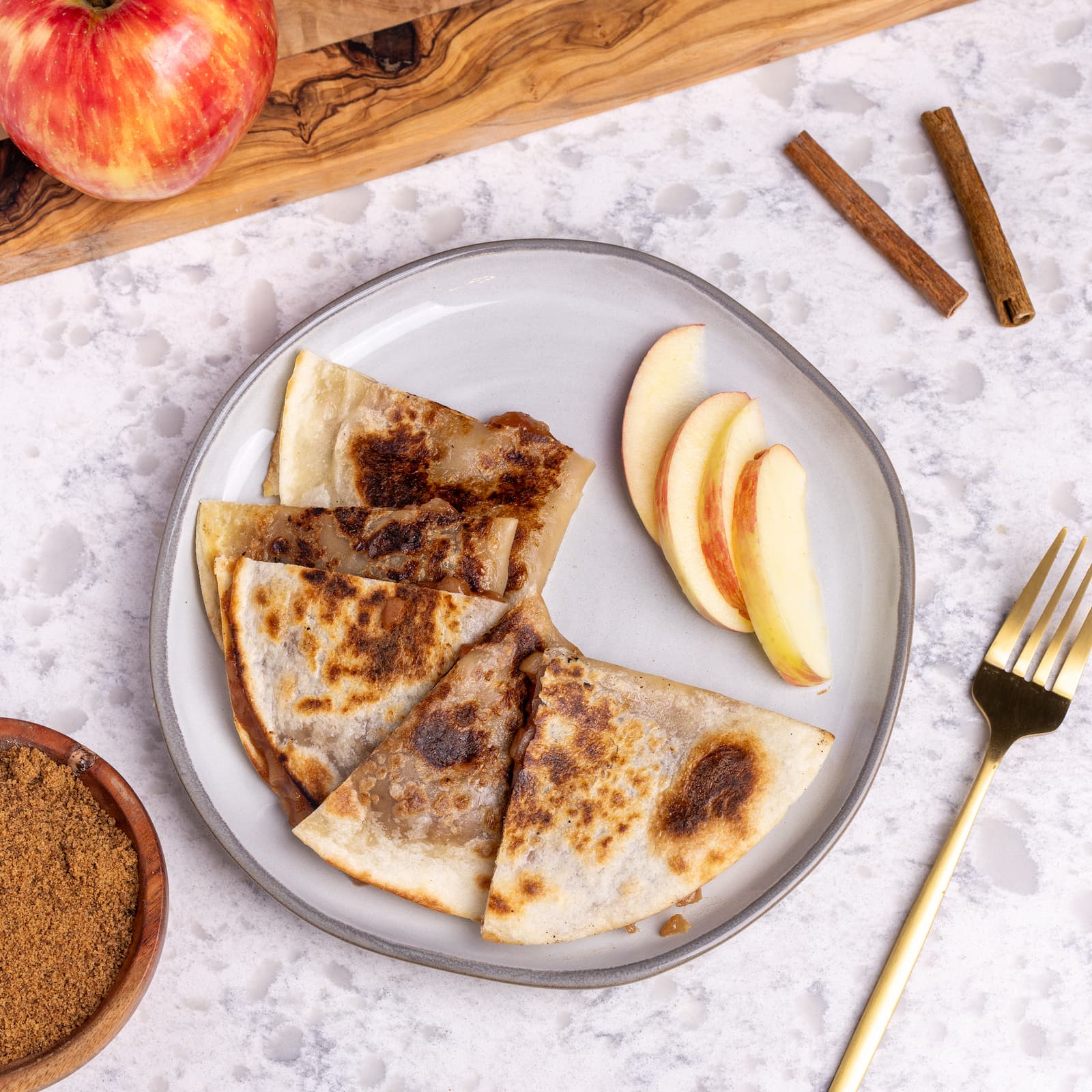 Rise & Puff’s thin-crust apple pie, served on a plate.