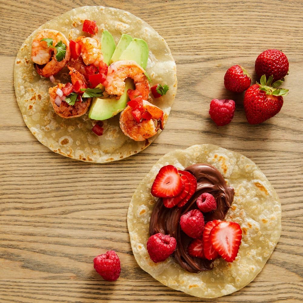 Rise & Puff tortillas topped with shrimp and avocado, plus a sweet chocolate tortilla with fresh berries.