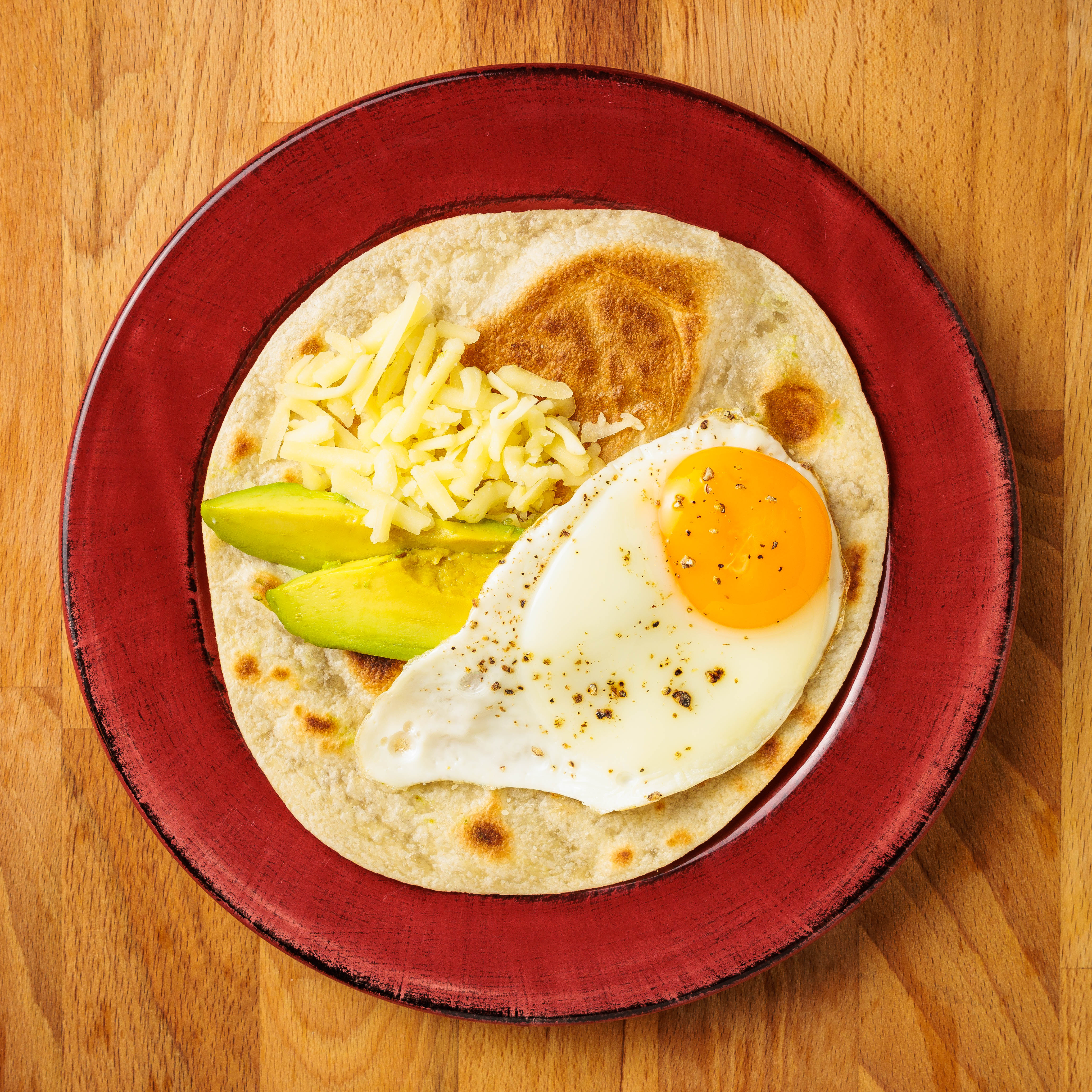 Fresh veggie wrap made with a Rise & Puff tortilla, filled with colorful vegetables for a low-sodium meal.
