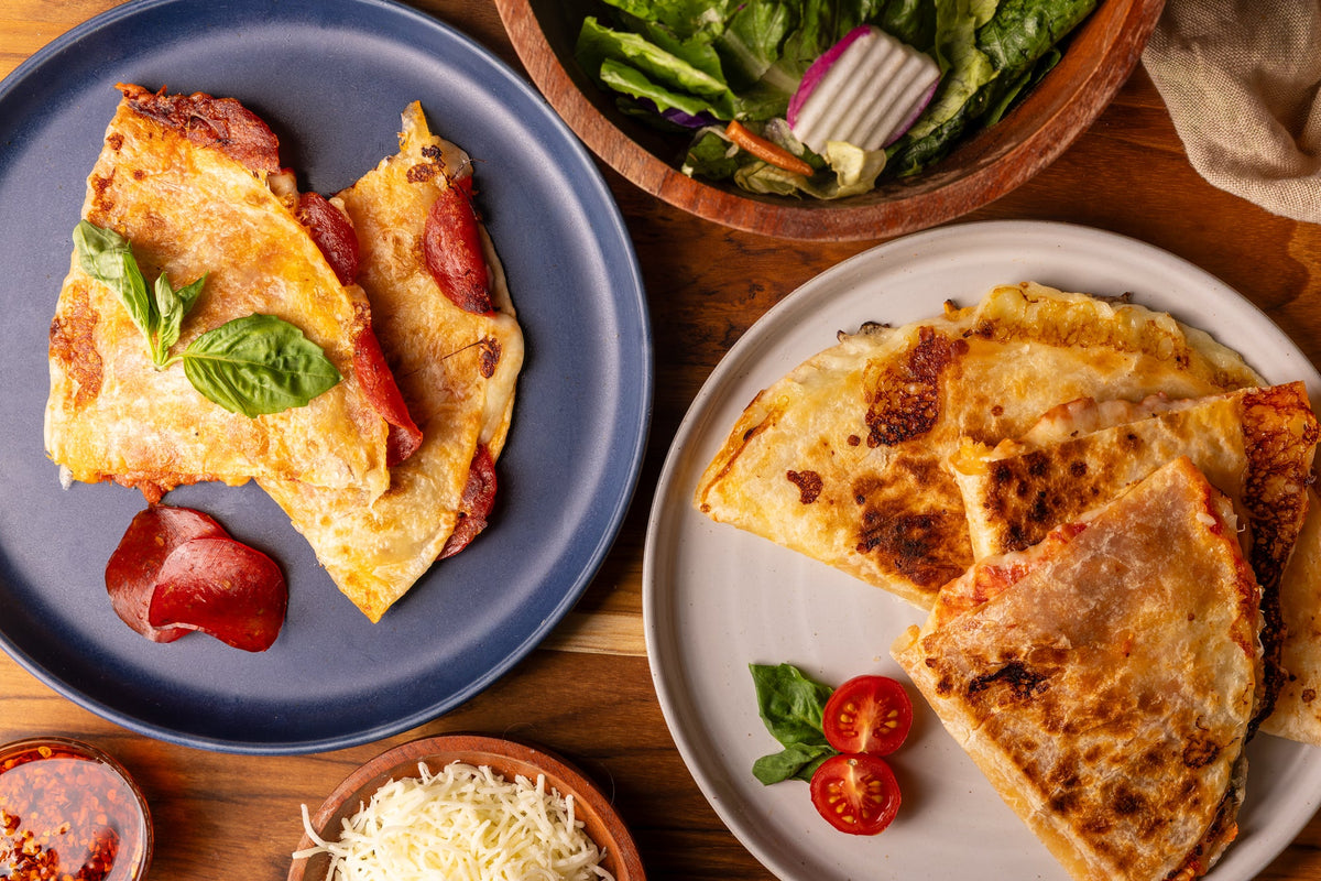 Rise & Puff pizza quesadillas on a plate with ingredietns