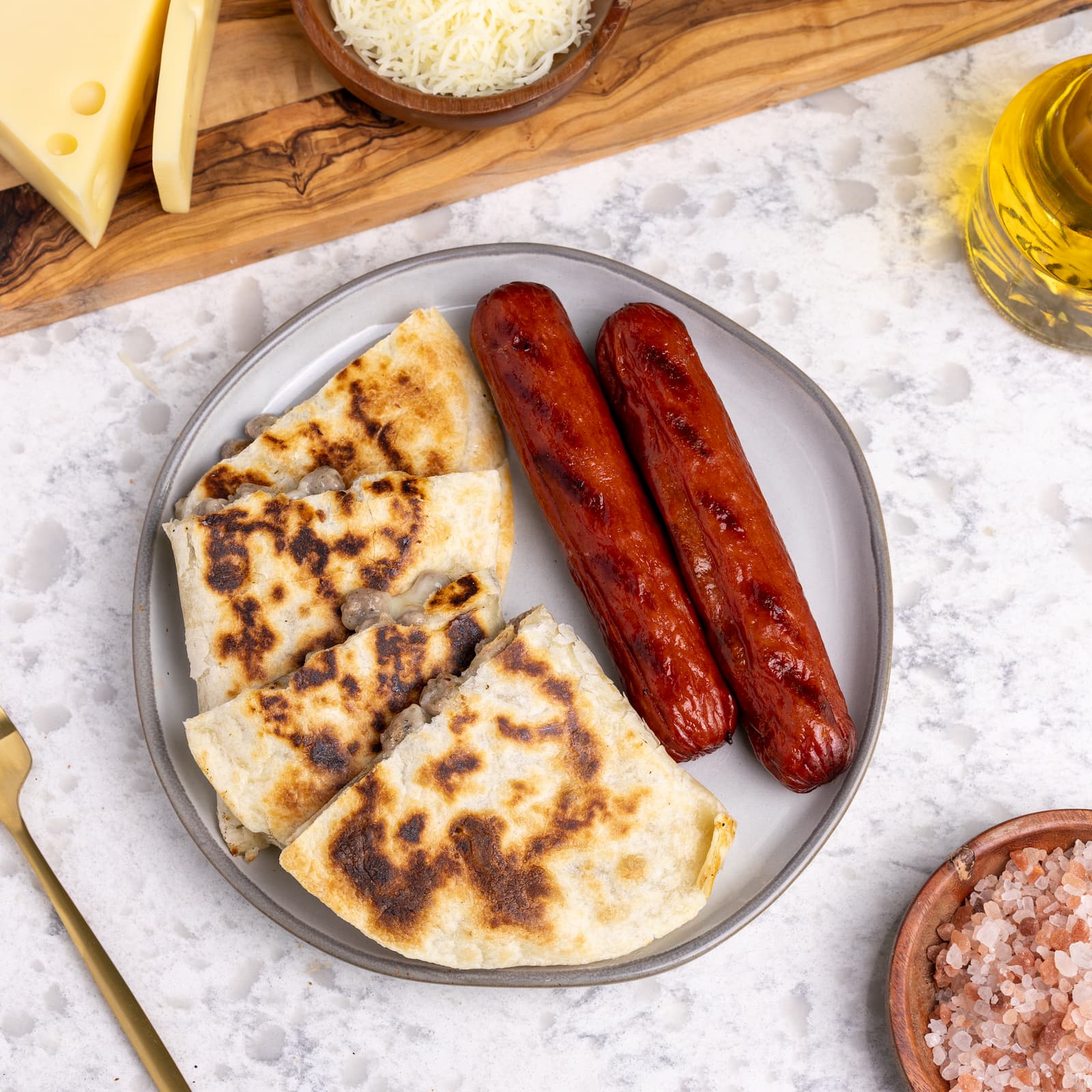 Healthy breakfast turkey sausage quesadilla with ingredients on plate
